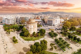 Aerial panoramic view of the main symbol of Thessaloniki city and the whole of Macedonia region - the White Tower. Concept of travel and sightseeing attractions in Greece